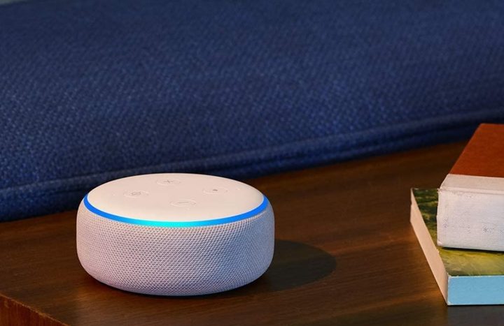 Amazon Echo Dot smart speaker sitting on a table.