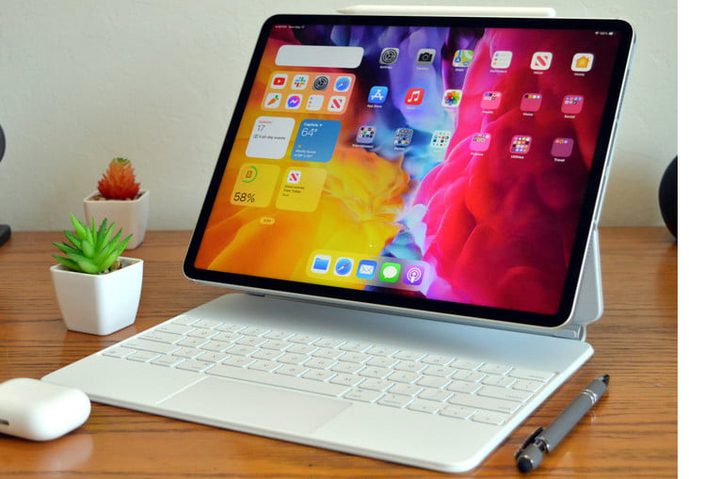 A 2021 iPad Pro is attached to a keyboard on a desk.