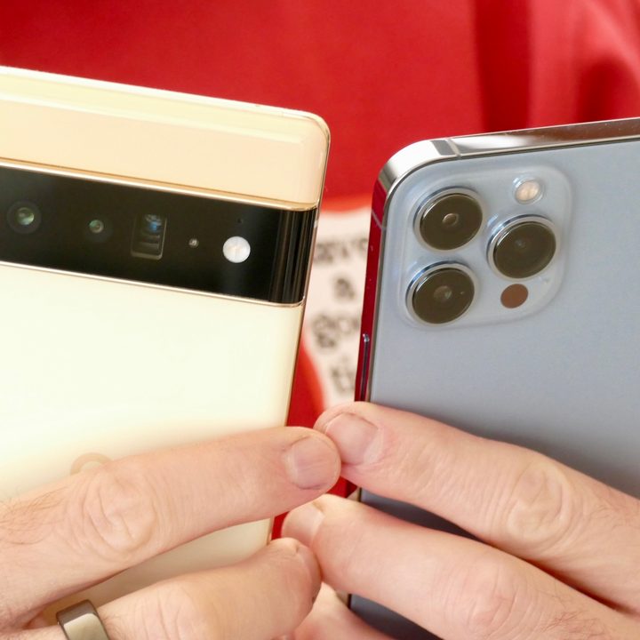 iPhone 13 Pro and Pixel 6 Pro in hand.