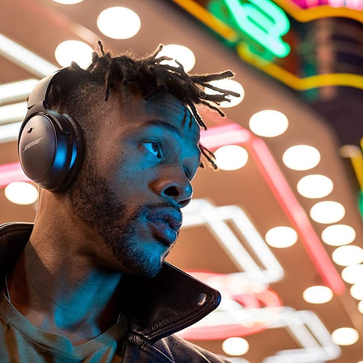 Man wearing Bose QuietComfort 45 Wireless Noise Cancelling Headphones.