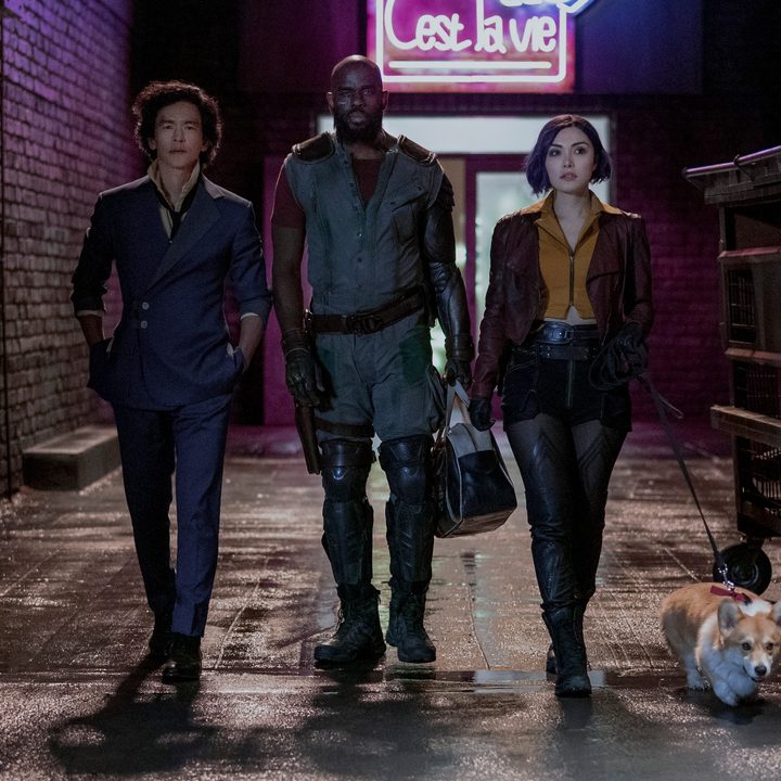 The cast of live-action Cowboy Bebop series walks down an alley.