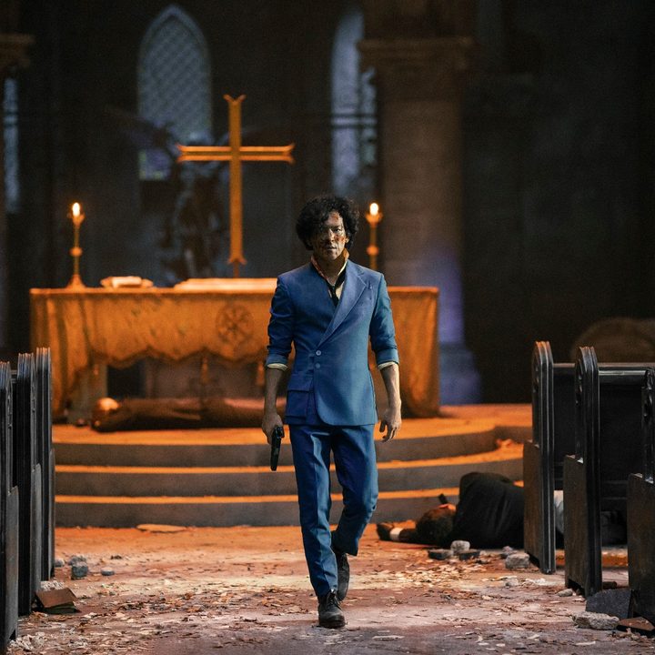 John Cho as Spike Spiegel walks out of a church in a scene from Cowboy Bebop.