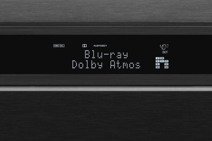 Close-up of an A/V receiver display showing Dolby Atmos.