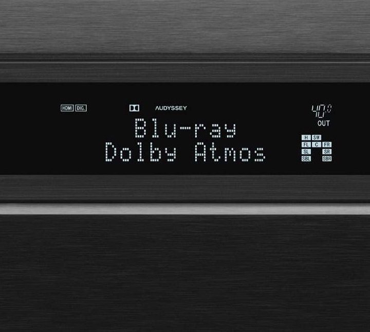 Close-up of an AV receiver display showing Dolby Atmos.