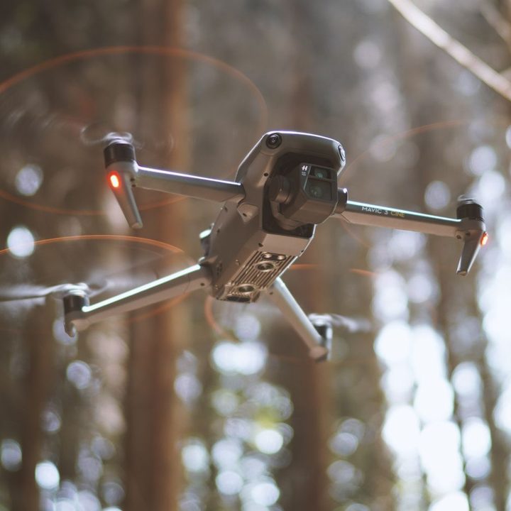 DJI Mavic 3 flying in a forest.