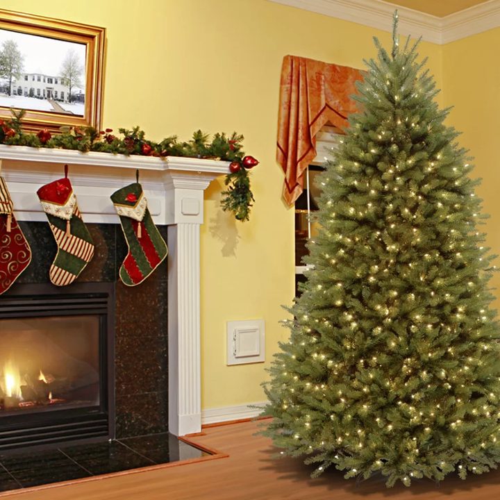 Dunhill Fir 7-ft 6-in green artificial Christmas tree with 750 clear white lights.