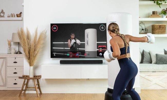 Woman boxing with FightCamp.