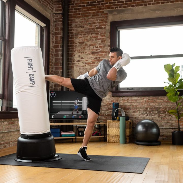 Man boxing with FightCamp.