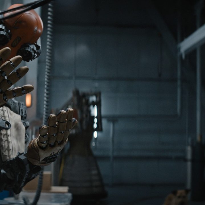 Jeff the robot and Tom Hanks in a scene from the movie Finch.