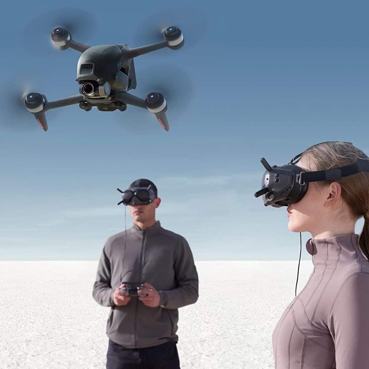 Flying DJI FPV drone with audience in VR view.