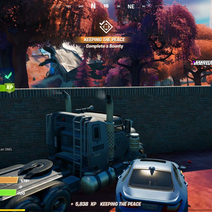 Destroying structures with a vehicle in Fortnite.