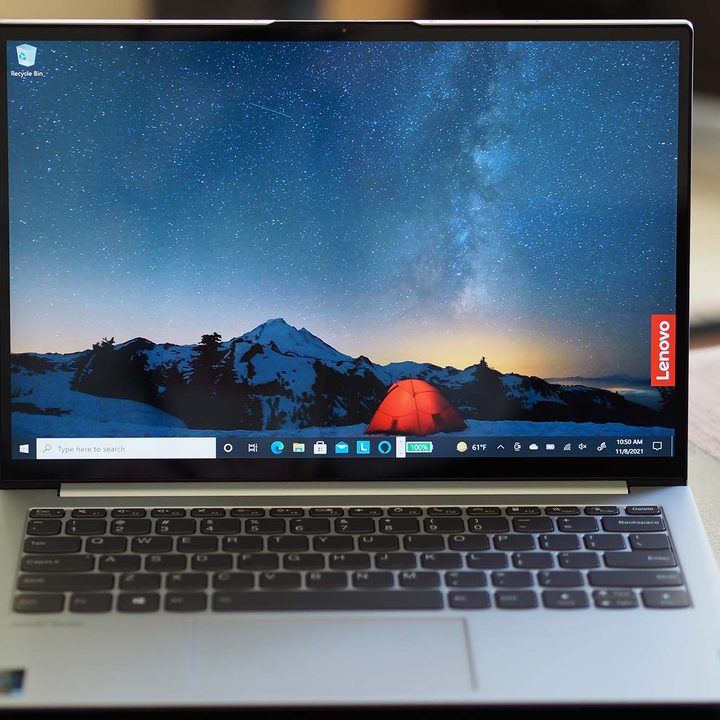 The Lenovo ThinkBook 13x sitting straight forward on a desk/