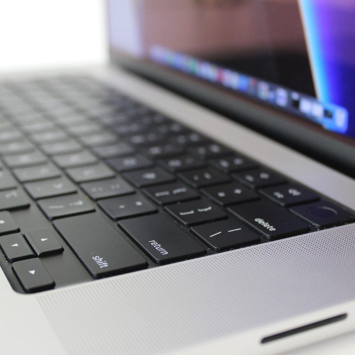 Apple MacBook Pro side view showing keyboard deck and ports.