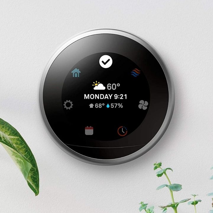 Nest Smart Thermostat on wall.