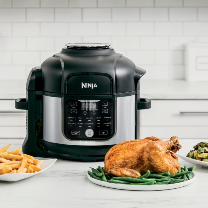 Ninja - Foodi 11-in-1 6.5-qt Pro Pressure Cooker + Air Fryer with Stainless finish, FD30, on counter with cooked chicken.
