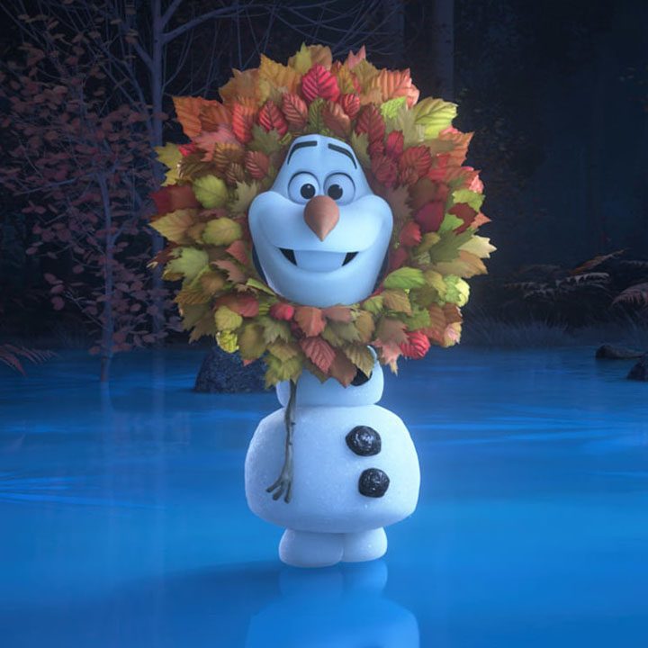 Olaf standing on ice wearing leaves around his head in a scene from Olaf Presents.