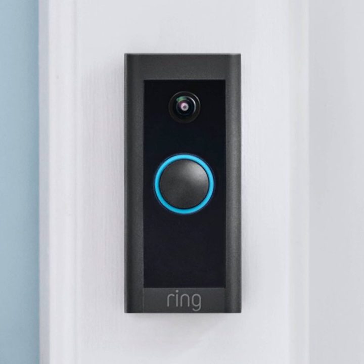 A Ring Video Doorbell Wired set up next to a front door.