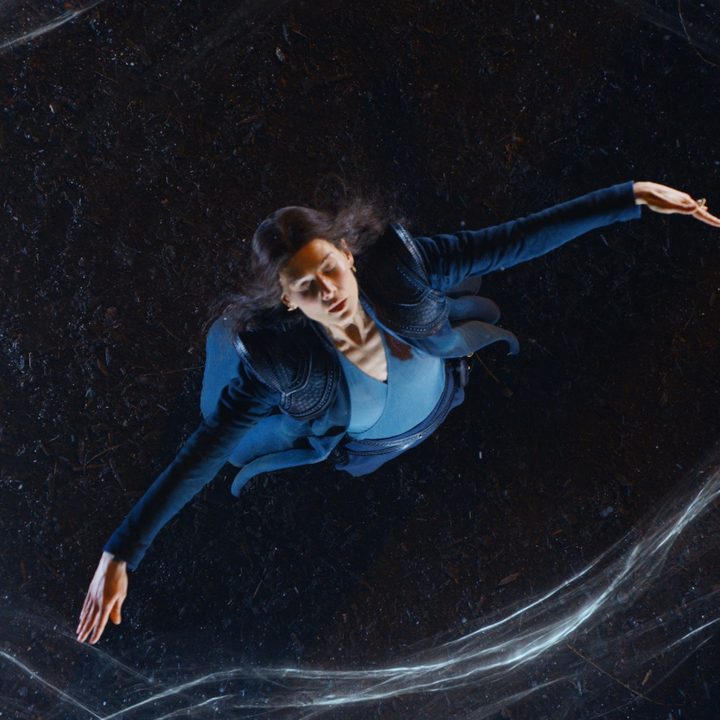 Rosamund Pike's character wields magic in a scene from The Wheel of Time series.
