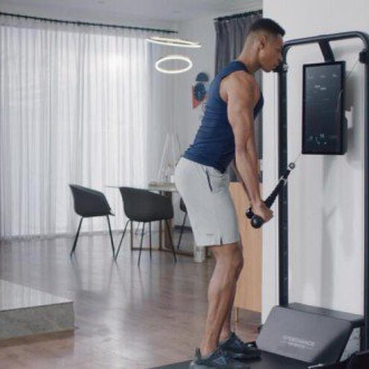 Male using speediance home gym.