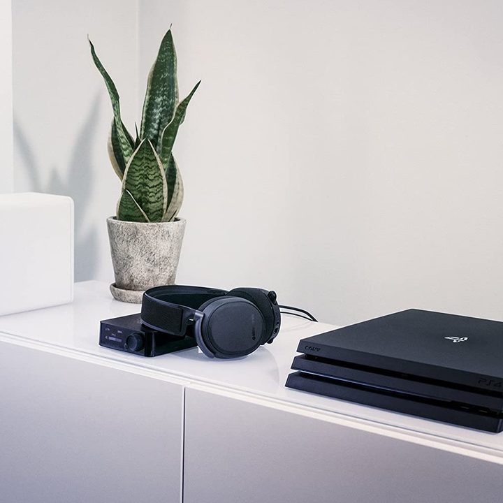 SteelSeries Arctis Pro headphones next to PlayStation.