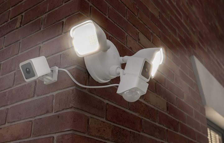 Wyze Cam Floodlight on the corner of a brick house.