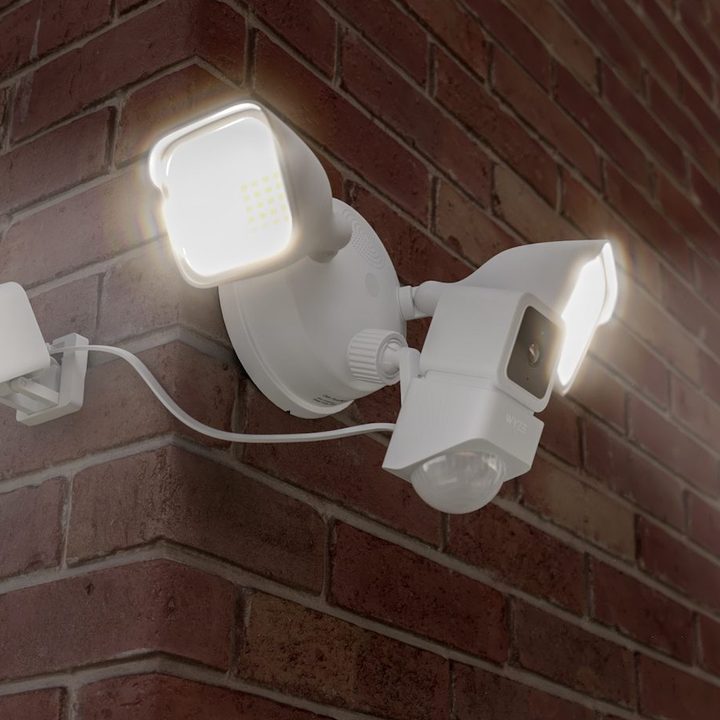 Wyze Cam Floodlight mounted outside of brick home.