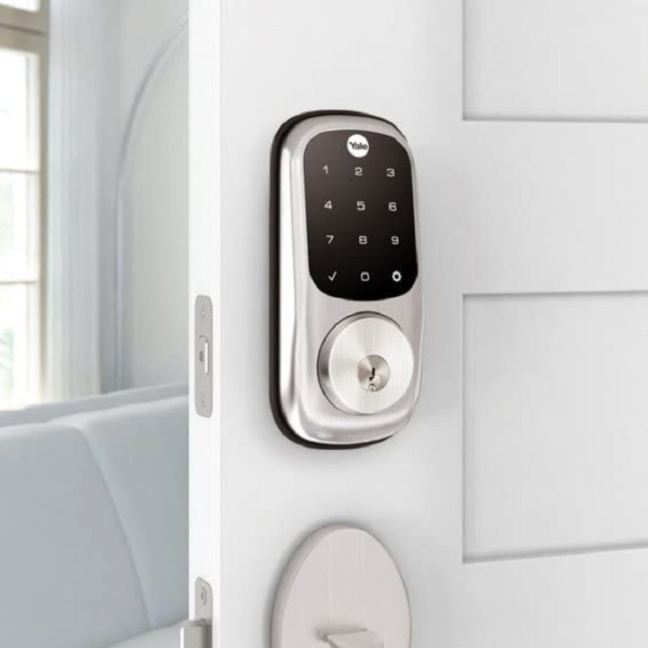 The Yale Assure smart lock installed on a door.
