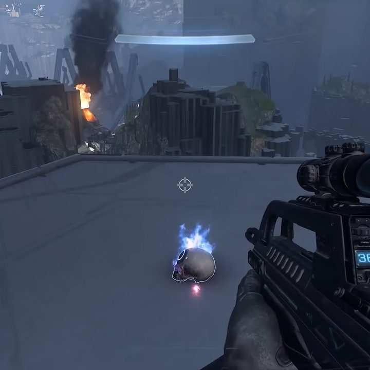 A glowing skull on a grey pillar.