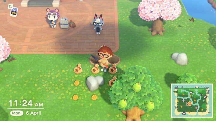 Standing next to money in Animal Crossing: New Horizons.