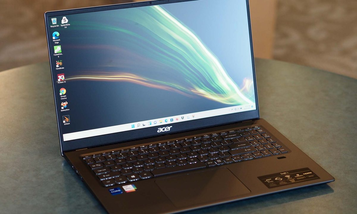 An Acer Swift 3 16 laptop sits on a desk, angled to the right.