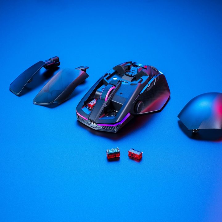 Asus ROG Chakram X mouse on a blue background.
