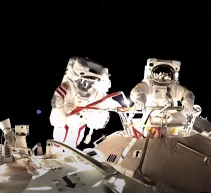 Two astronauts conduct a spacewalk at China's space station.
