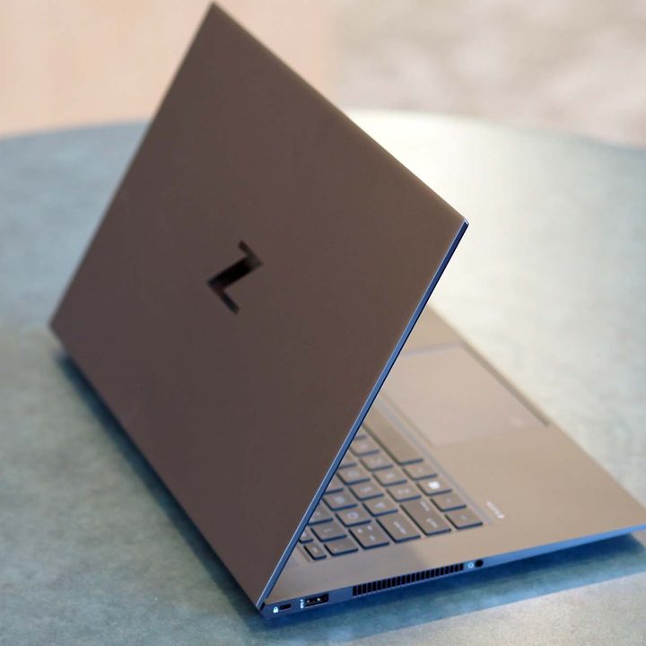 A HP ZBook Studio G8 sits on a table showing off the backside and lid.