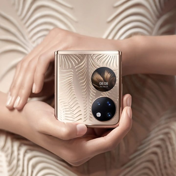 The Huawei P50 Pocket Premium Edition in the golden color option showing its camera setup and the cover display.