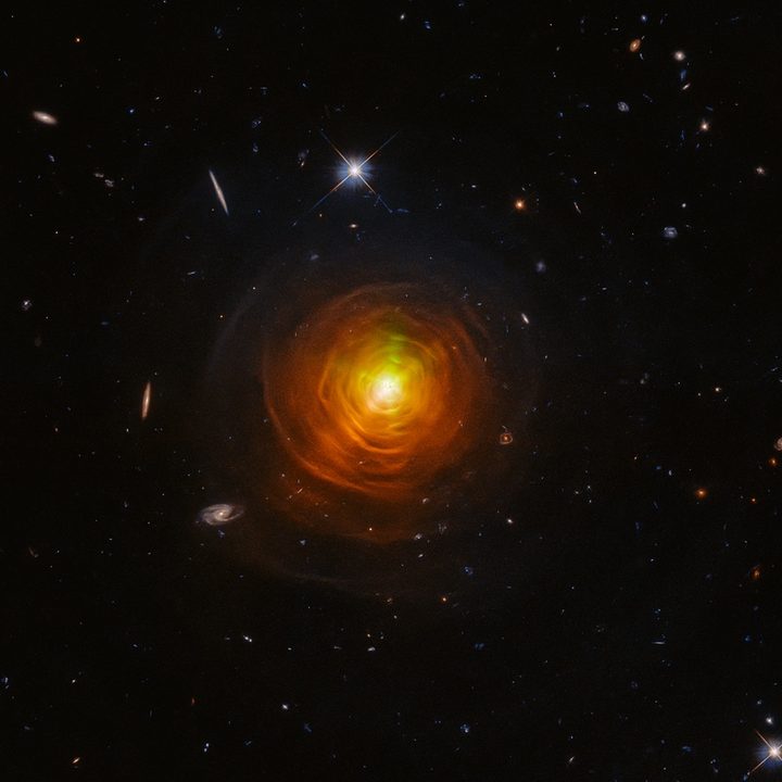 Dusty clouds of sooty carbon engulfing a dying star.