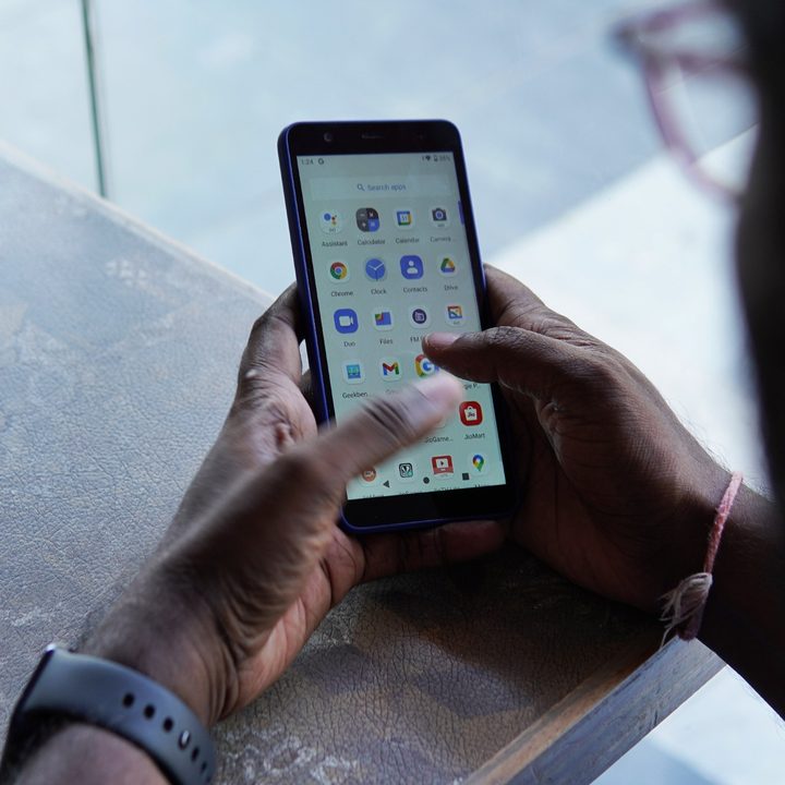 Man using the JioPhone Next.