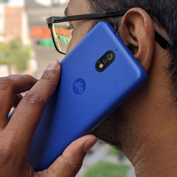 A person making a all on the JioPhone Next