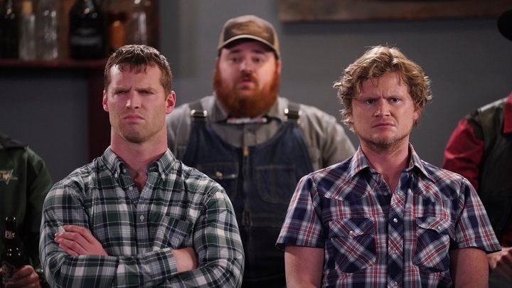 Three main characters from Letterkenny standing together, wearing plaid and overalls.