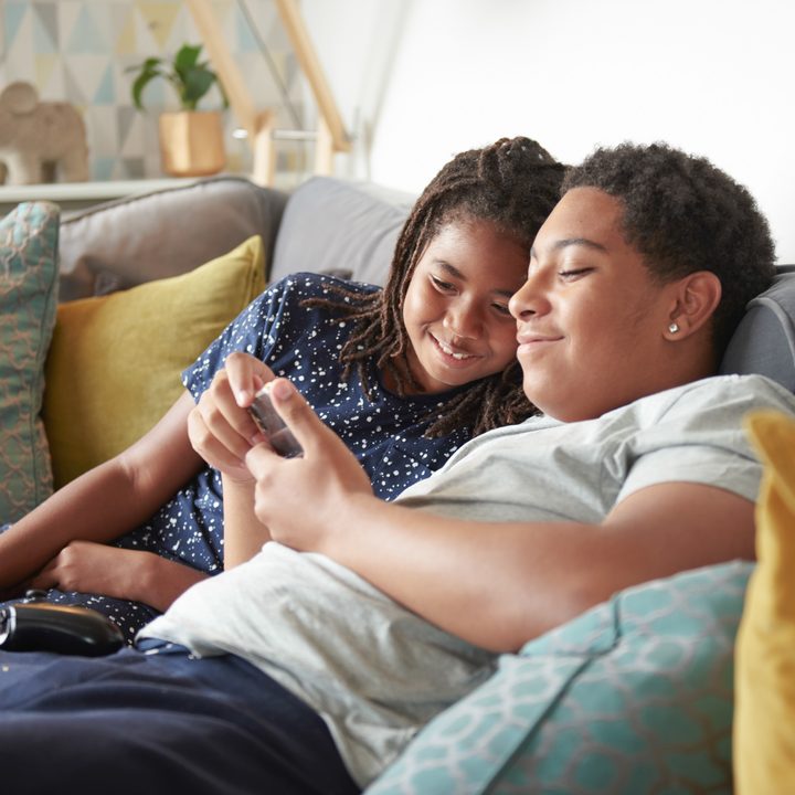 Brothers bonding looking at phone safely thanks to MTP.