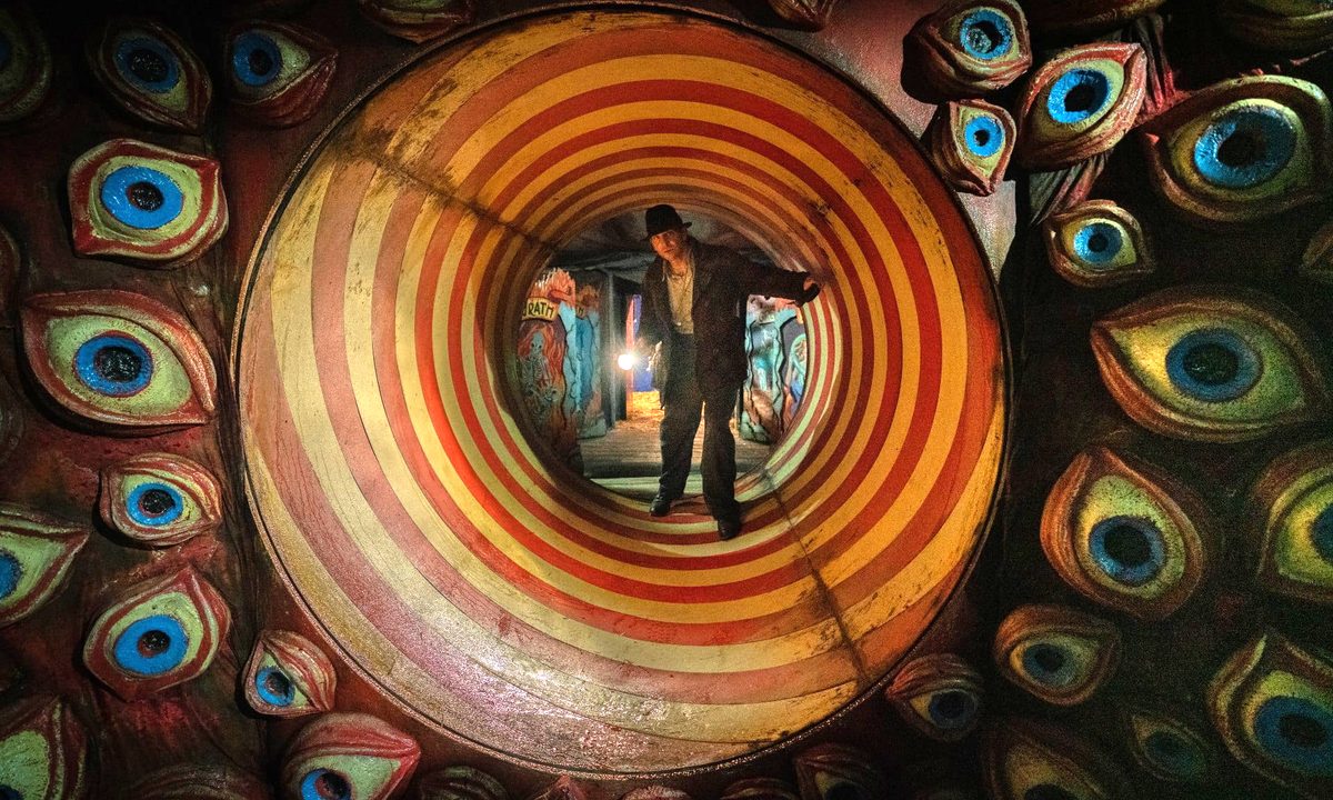 Bradley Cooper navigates a carnival funhouse in Nightmare Alley.