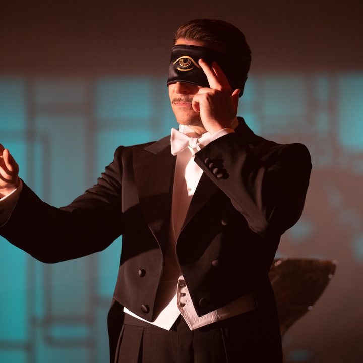 Bradley Cooper is masked in a scene from Nightmare Alley.