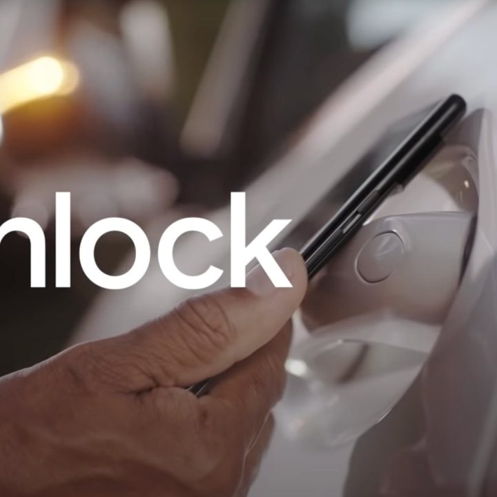 Google Pixel 6 phone tapping to unlock a car door.