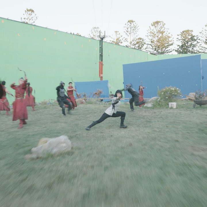 Production of a fight scene against a green screen backdrop in Shang-Chi and the Legend of the Ten Rings.