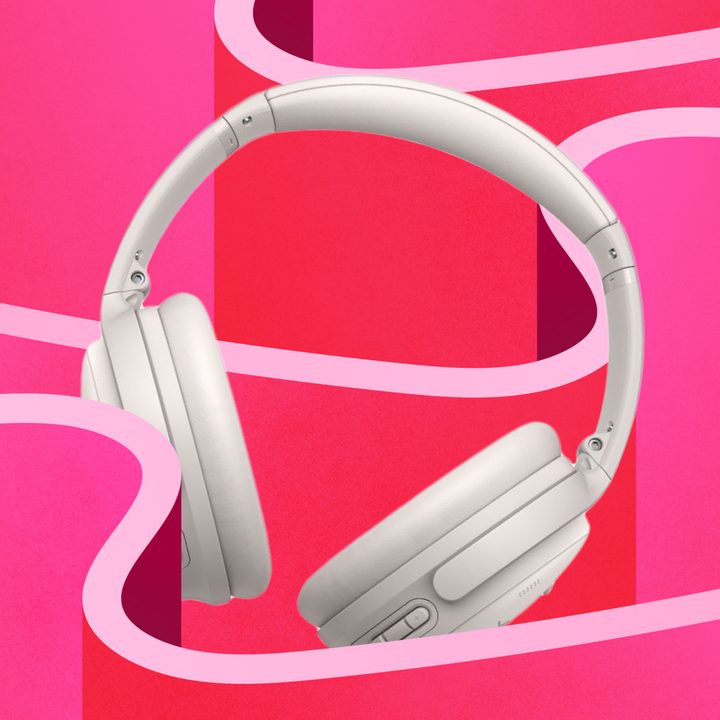 Bose QC45 ANC headphones image on a pink stylized background.