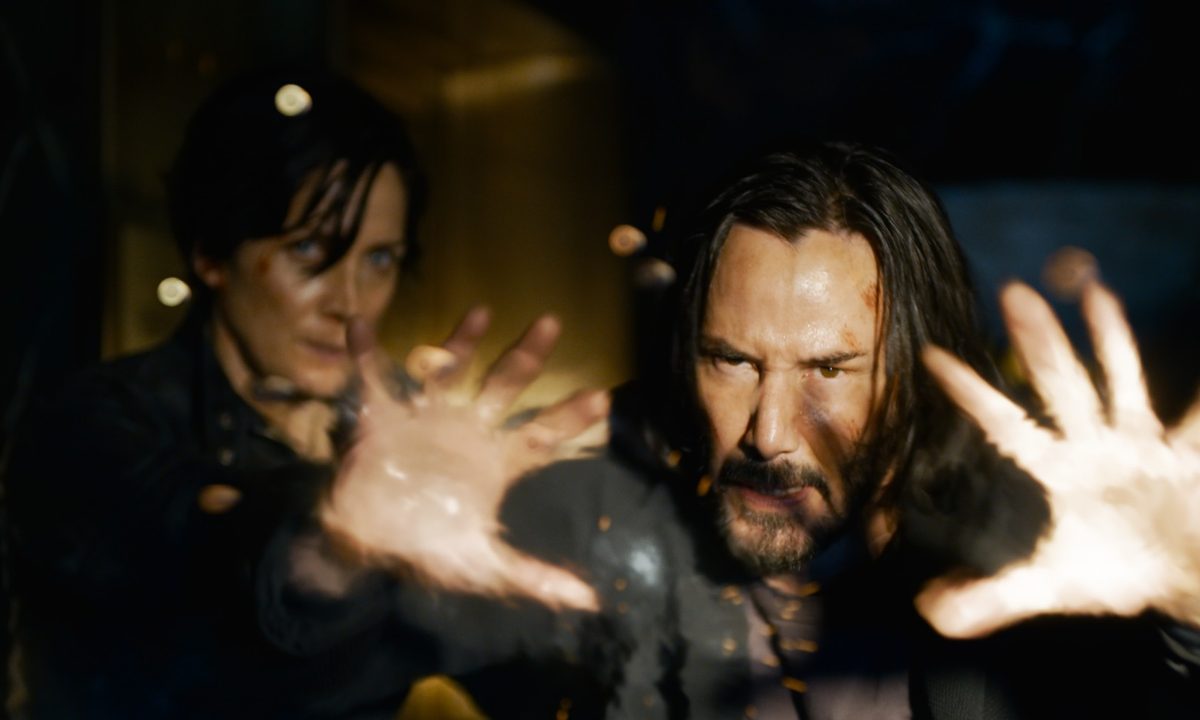 Carrie-Anne Moss and Keanu Reeves in a scene from The Matrix Resurrections.