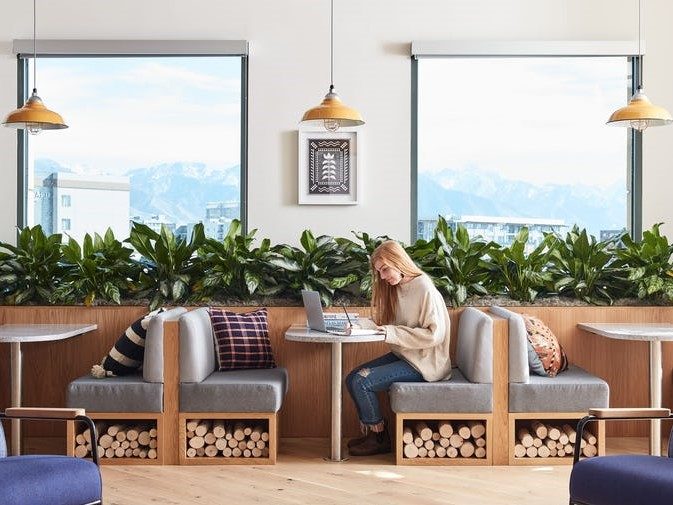 WeWork coworking space with wood decor under benches.