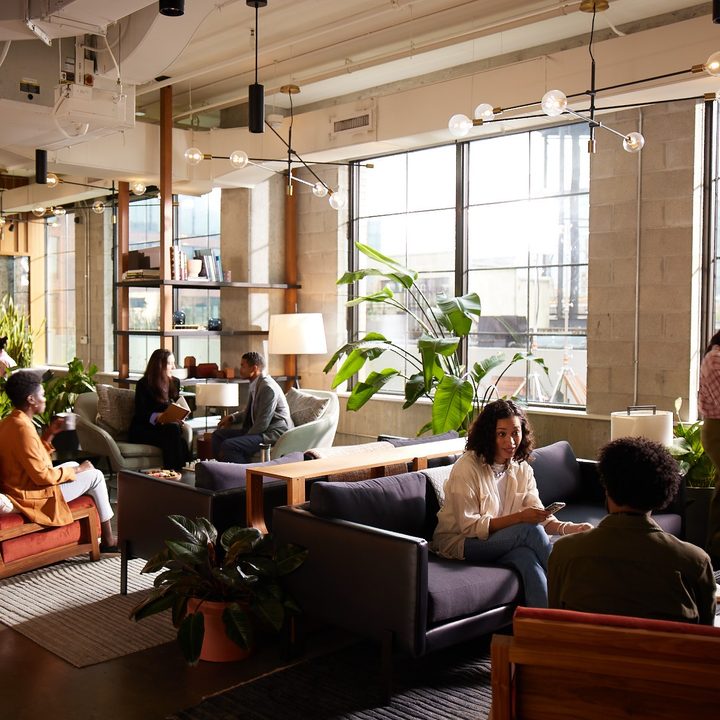 Working in Industrious' energetic space with people working in it.
