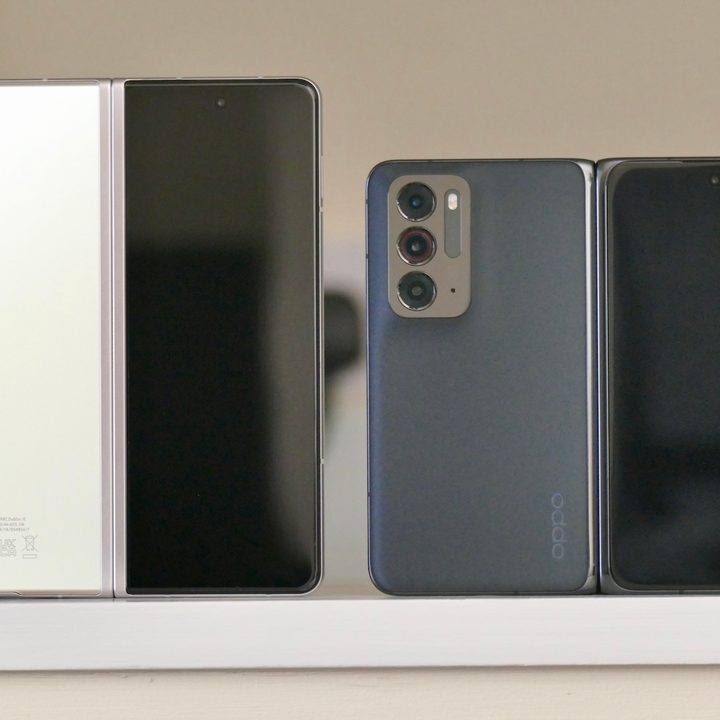 The Galaxy Z Fold 3 (left) and Oppo Find N open from the back.