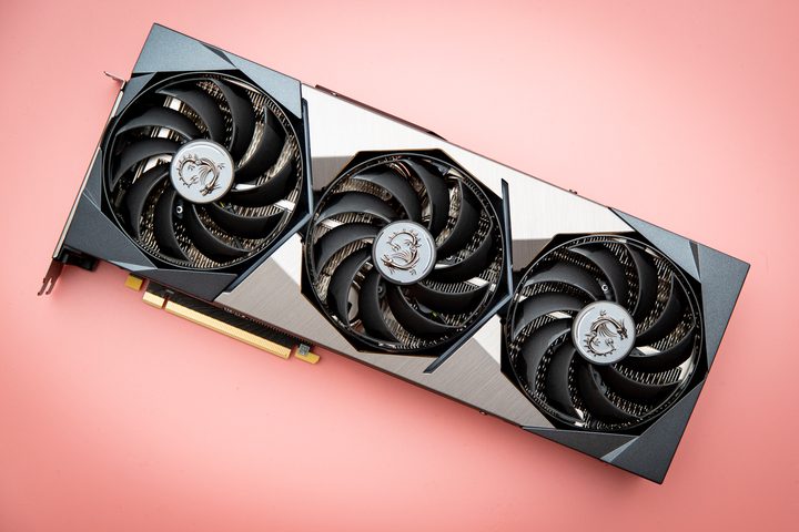 RTX 3080 graphics card on a pink background.