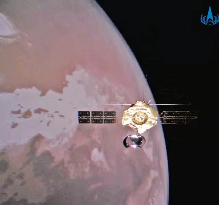 The Tianwen-1 orbiter is seen above Mars.